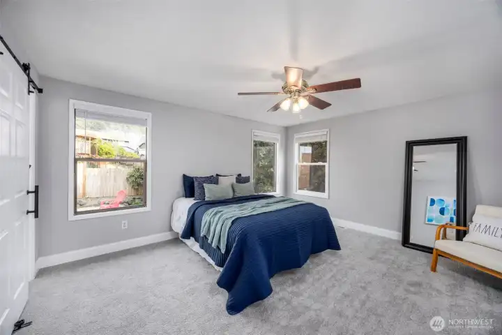 Primary bedroom with walk-in closet and ensuite bathroom.