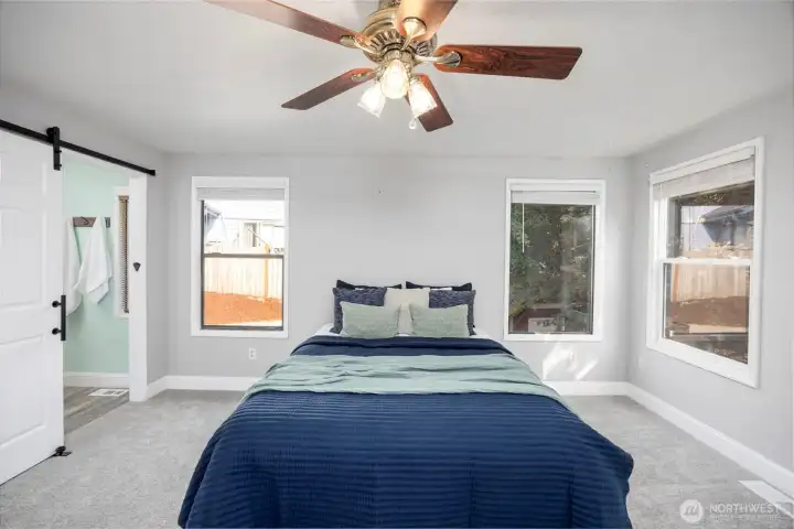Primary bedroom with walk-in closet and ensuite bathroom.