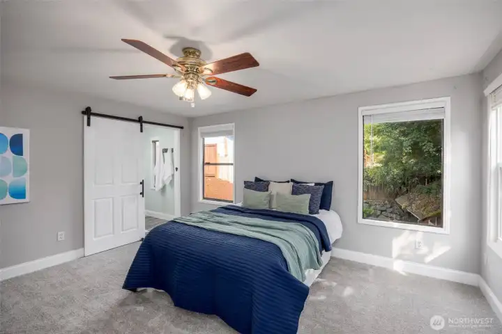 Primary bedroom with walk-in closet and ensuite bathroom.