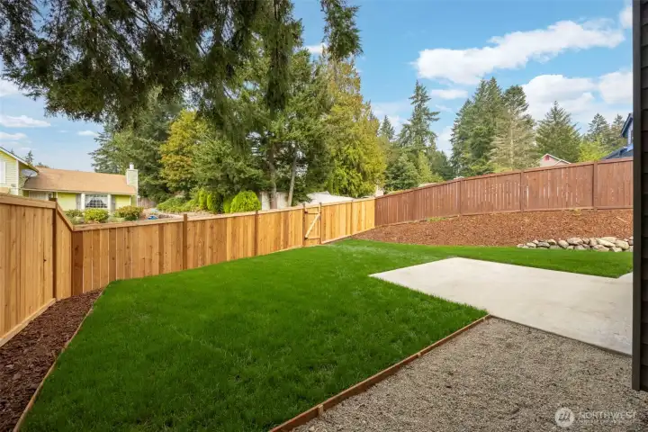 Side yard with new sod & NEW fence.