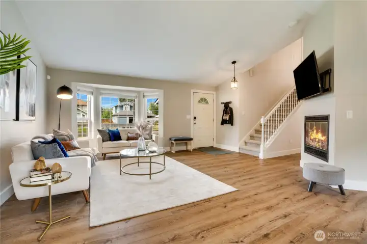The gas fireplace, bay window, and vaulted ceiling make this a favorite room of the house.