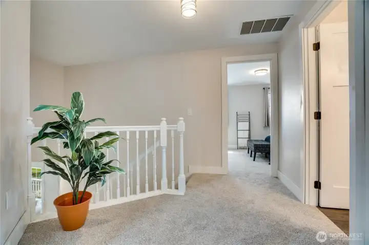 Head up the open staircase to visit the bedrooms and 2 more bathrooms.