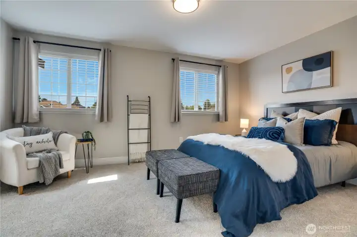 The primary suite overlooks the front yard and neighborhood and features fresh paint, new lighting, new blinds and flooring as throughout the home.