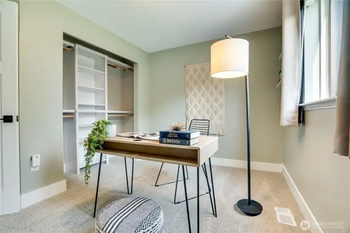 Just next door this updated 3rd bedroom features a new closet organizer.