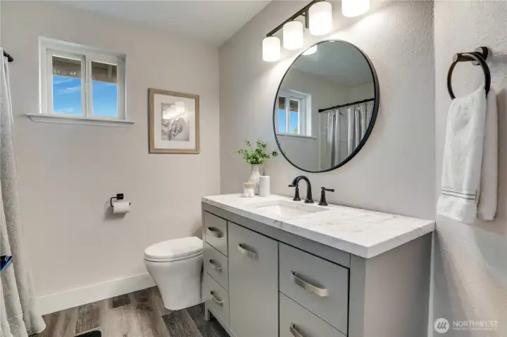 The updated full bath is just outside the bedrooms on the 2nd floor landing.