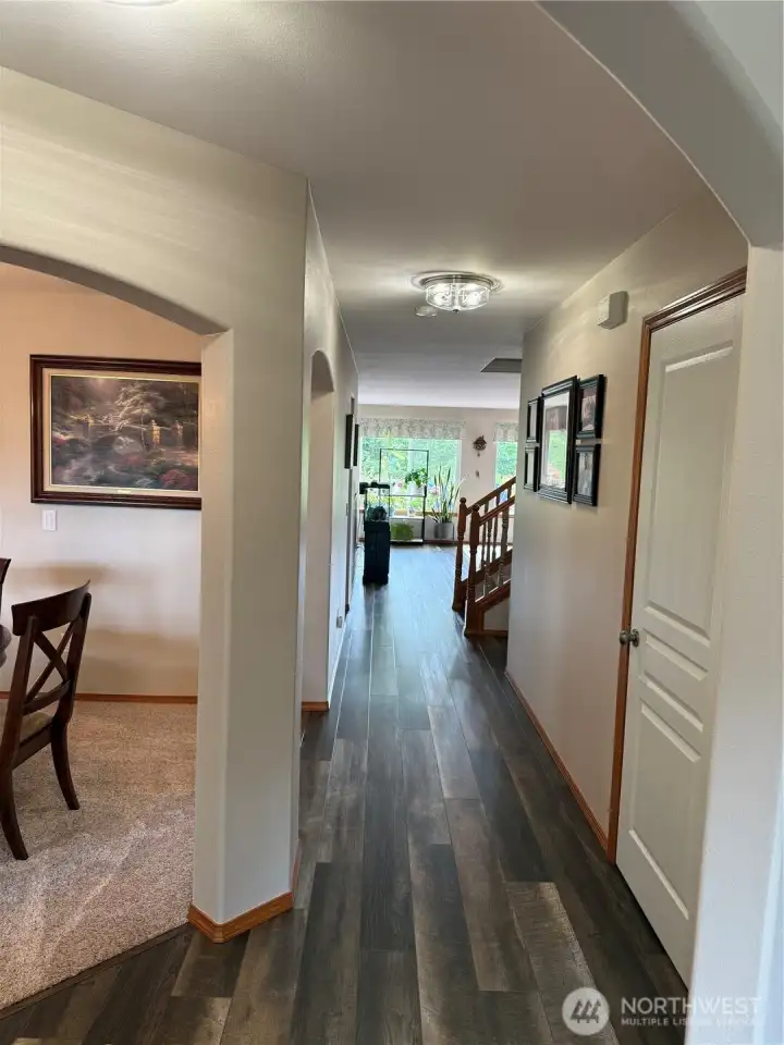 Entry w/ dining on left and living room/office to the right.