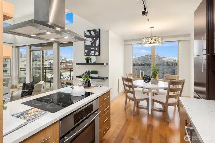 Open concept kitchen opens to living room, dining room and views!