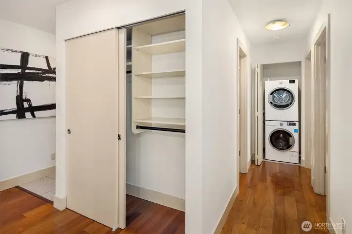 Washer and dryer at the end of the hall by the bedrooms.  Note front closet, with lots of space and nicely built out!