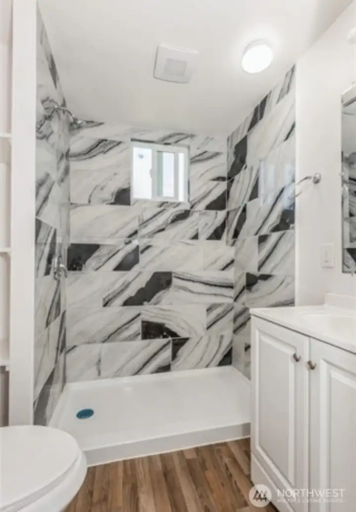 A second bathroom with shower, providing added convenience for guest and household members.