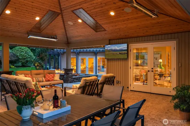 Perfect outdoor living space with cathedral skylighting. Outdoor BBQ fun with heaters.