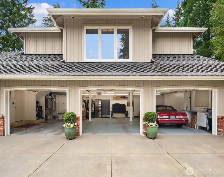 Large 3 car garage with extra coverage in back barn.