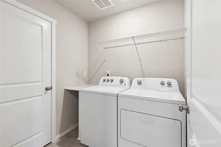 Spacious Laundry Room. hotos are representative only and may display different color package and/or upgrades.