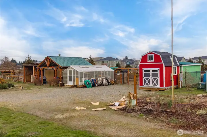 Greenhouse, 20x20 Gazebo, 3 sheds, 2 outbuildings and a chicken coup