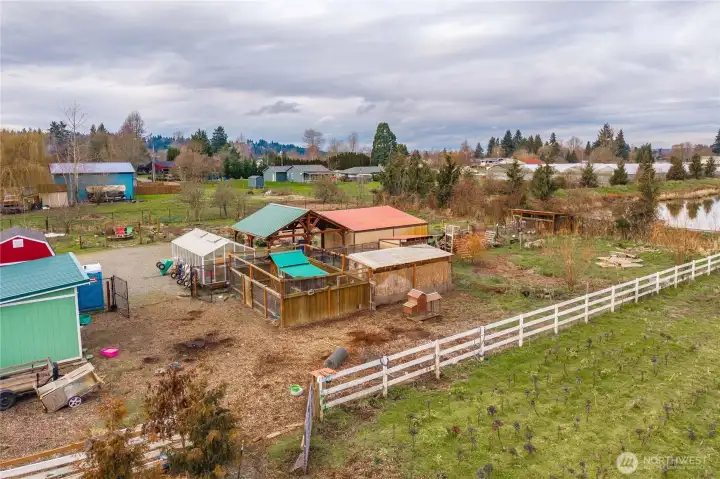 Property includes Greenhouse, 20x20 Gazebo, 3 sheds, 2 outbuildings and a chicken coup