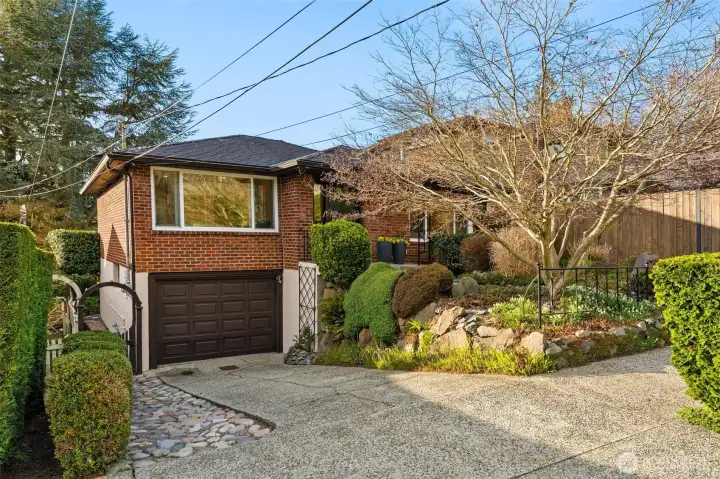 This adorable 1950s brick home offers a warm, easygoing lifestyle just 1/2 block from the trails, beaches, and open spaces of Discovery Park.