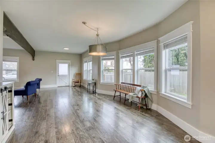 Bay window in open concept dining room with plenty of room for entertaining