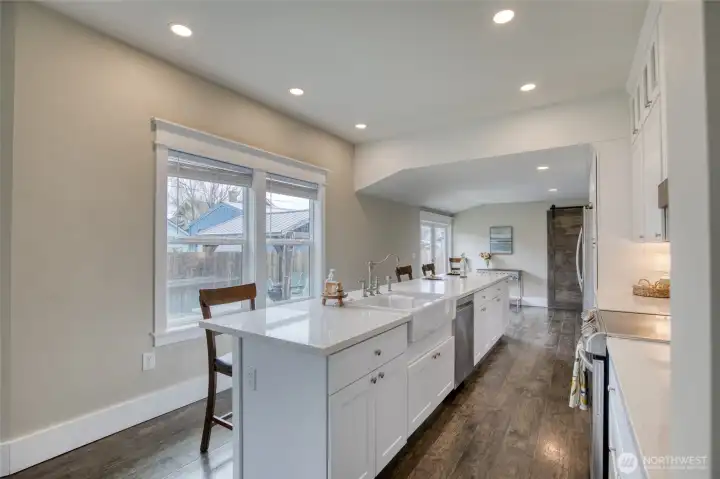 Oversized quartz island with sink and dishwasher for convivence