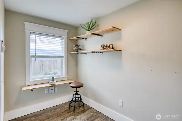 Downstairs office located near kitchen and half bath