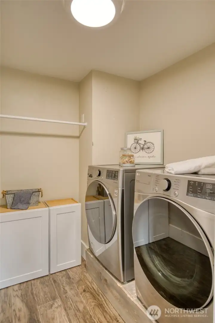 Nicely sized laundry room with storage. Washer and dryer included in sale