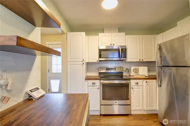 Lots of cabinets, stainless appliances.