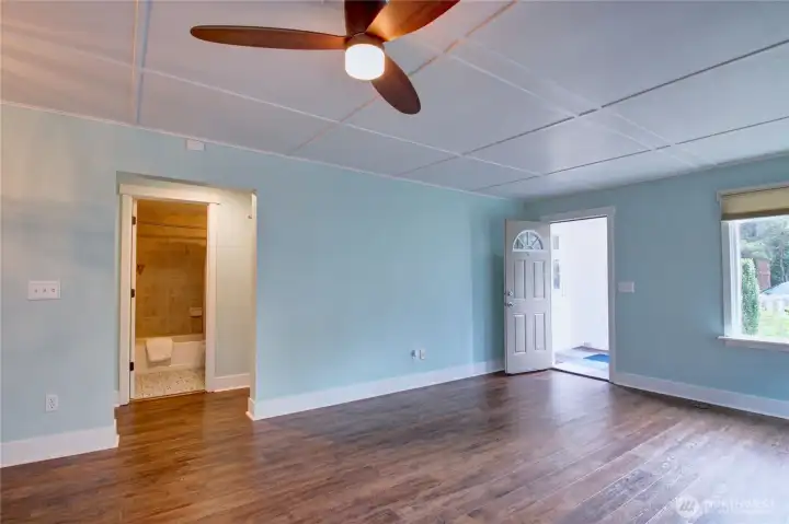 Enclosed front porch, hallway to the bedrooms and main bathroom.