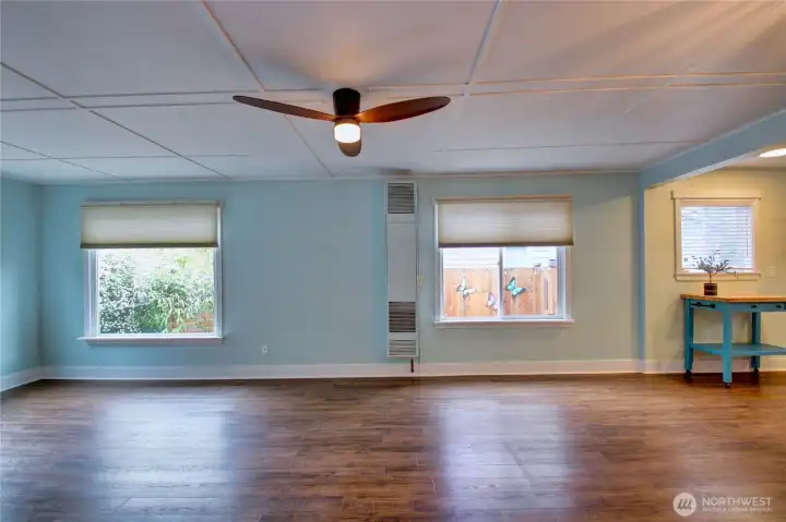 Living room with Hunter Douglas up & down blinds, ceiling fan and lots of natural light.