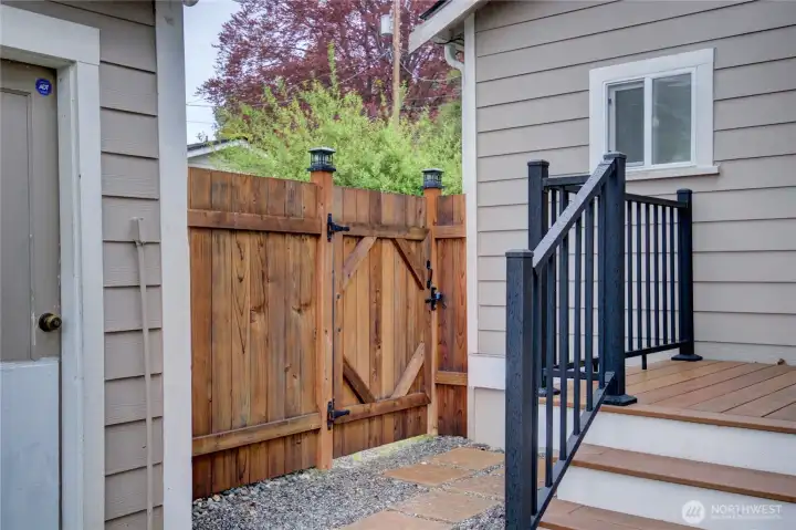 Back porch, fenced yard and access to the garage.