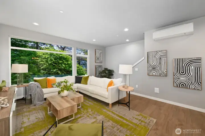 Drenched in southern light, this spacious living room can accommodate a large sectional sofa and more!