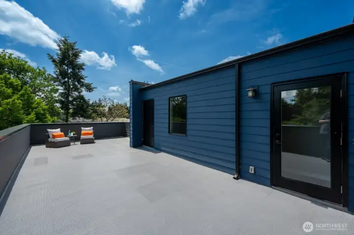 Roof top deck spans the length of the home.  Convenient storage closet too!