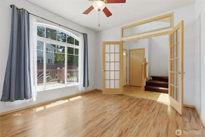 A spacious front entry space then to the right through french doors to a sun filled room with a view to the front of the property.