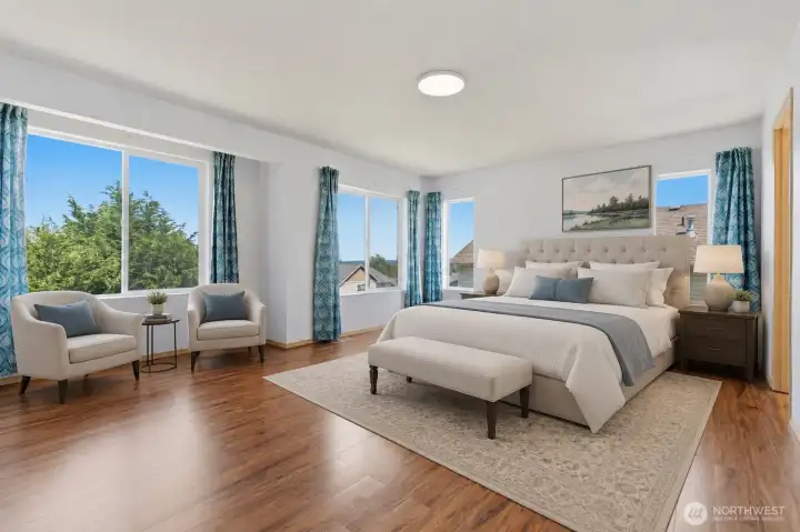 Virtually staged, this principal bedroom is a restful and luxurious retreat.