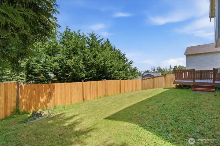 Enjoy the larger lots found in this era development. A fully fenced back yard is secure for pets. The large deck is perfect for private outdoor entertaining or relaxation.  The property boundary is not the back fence line. It extends slightly beyond to the tree line.