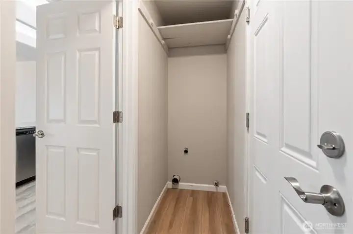 Laundry space off of kitchen, with garage entry