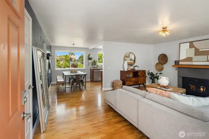 Gleaming oak hardwoods throughout. Walk into a spacious living room with a wood burning fireplace.