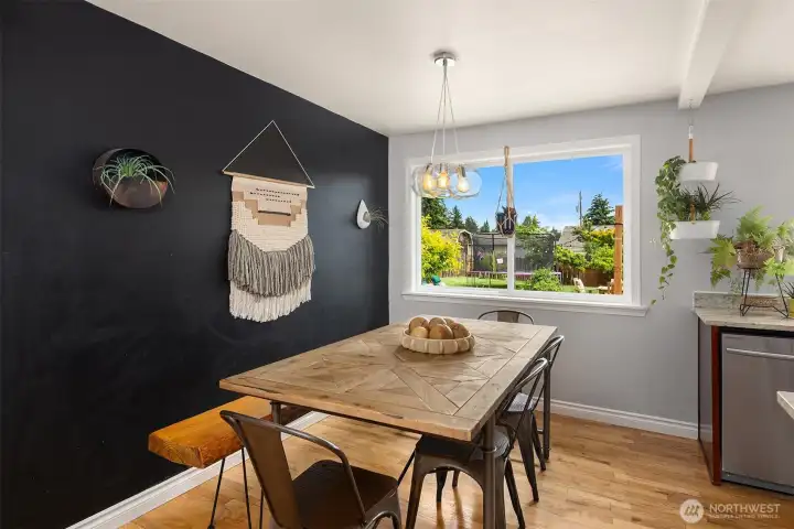 Dining room off kitchen overlooks back garden.