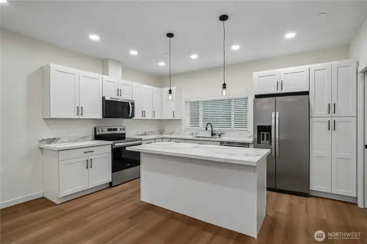 Representative image from a completed project provided as an example of the anticipated kitchen finishes, materials, and overall design aesthetic for this development. Actual finishes may vary.