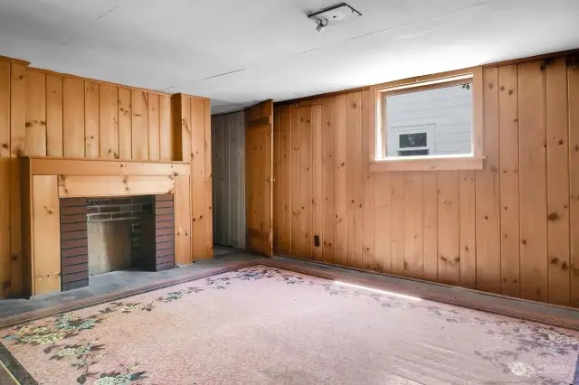800 sq. foot basement offers a vintage finished recroom with faux fieplace.