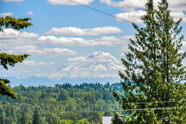 Awesome View.  Expansive view deck off french doors in kitchen lead to this view.  Cascade Mountain range and Mt. Rainier.