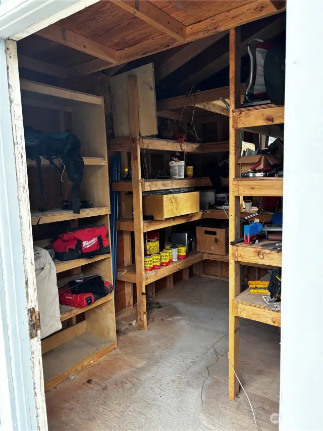 Great storage shed with lots of built in shelves.