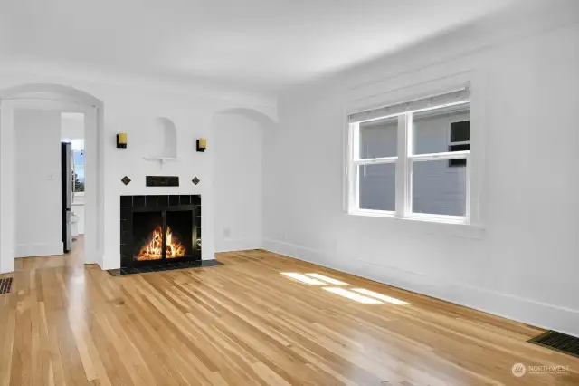 Gleaming newly refinished oak hardwood floors thruout the main floor.  Living room with gas fireplace.