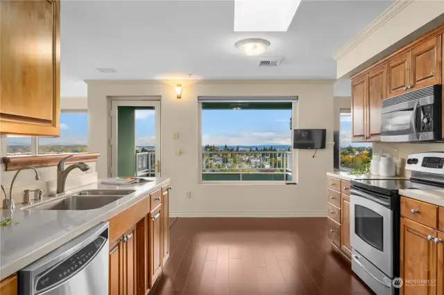 Kitchen overlooks the balcony and easterly views, to the right is the large family room .