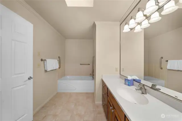 Common bathroom with tiled tub surround