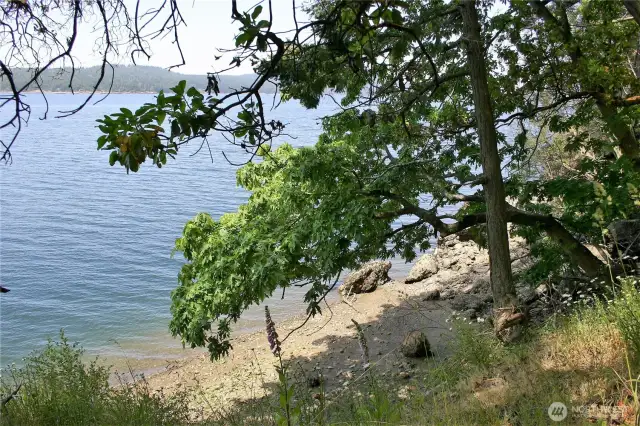 Sandy pocket beach at low tide