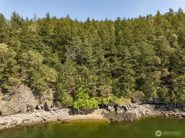 Sandy pocket beach in the center - rocky water access to the right