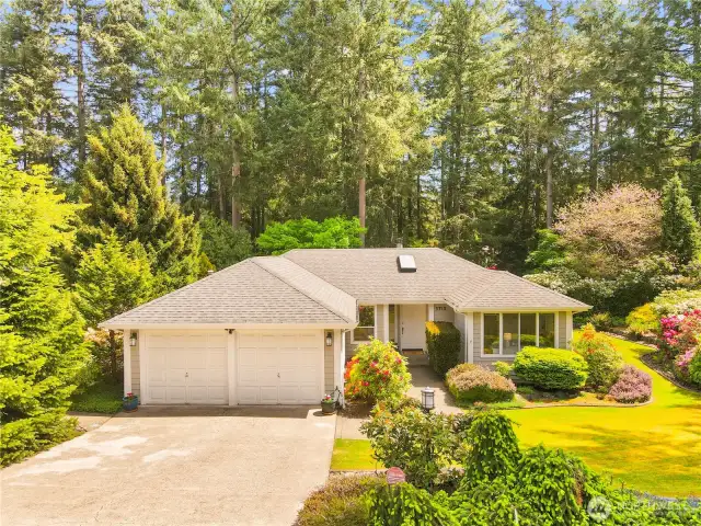 Mature landscaping, vibrate gardens & a well taken care of home!