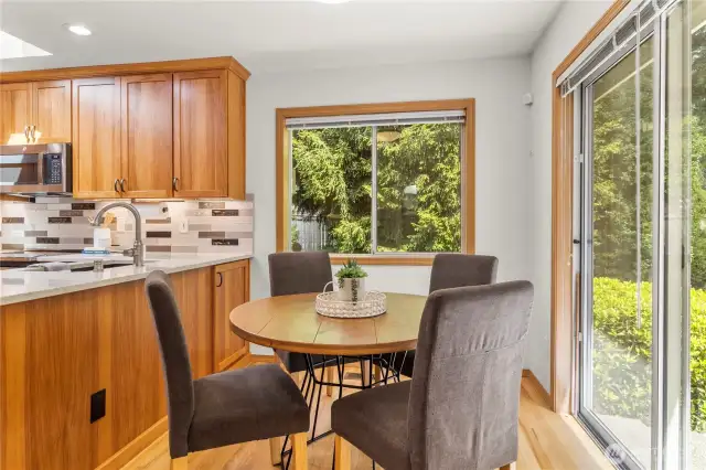 Convenient breakfast nook bathed in natural light —an inviting spot to start your day.