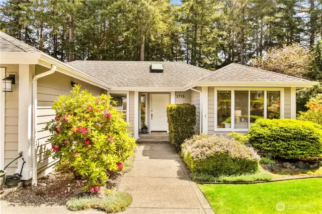 Mature landscaping, vibrate gardens & a well taken care of home!