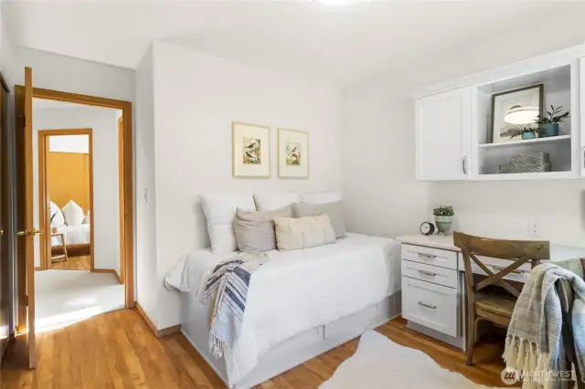 Third bedroom with custom built-ins and storage.