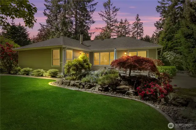 Custom landscaping surrounds the property.