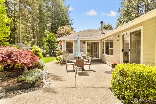The perfect patio to gather and enjoy the yard and gardens. Paved paths and custom landscaping surround the property.